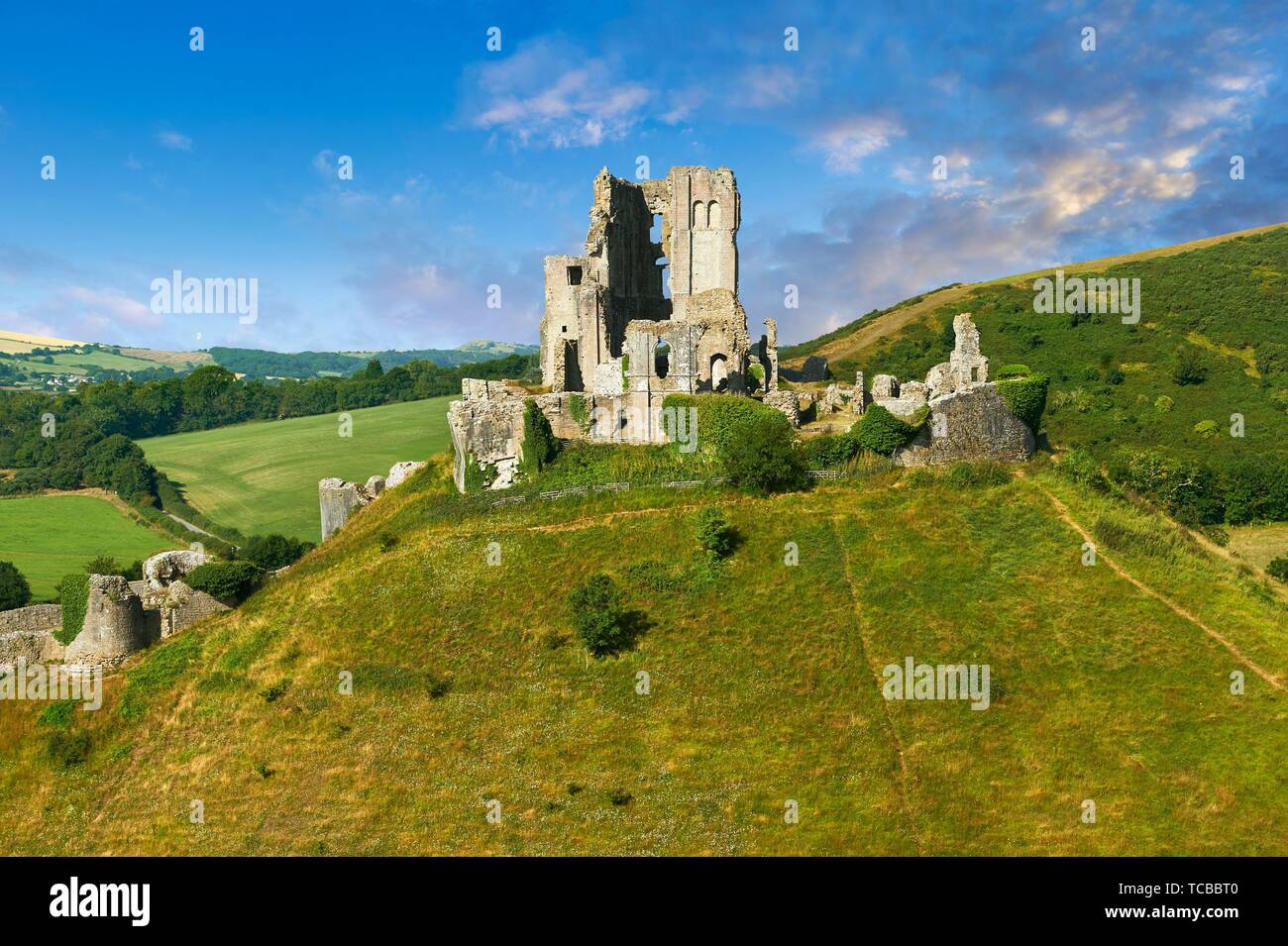 Medieval Corfe castle keep & battlements at sunrise, built in 1086 by William the Conqueror, Dorset England. Stock Photo