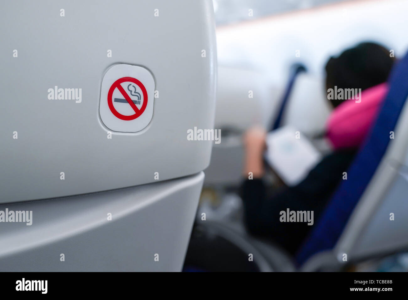 no smoking sign on plane seat Stock Photo - Alamy