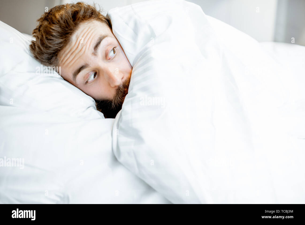 Man Hiding Under Duvet Hi Res Stock Photography And Images Alamy
