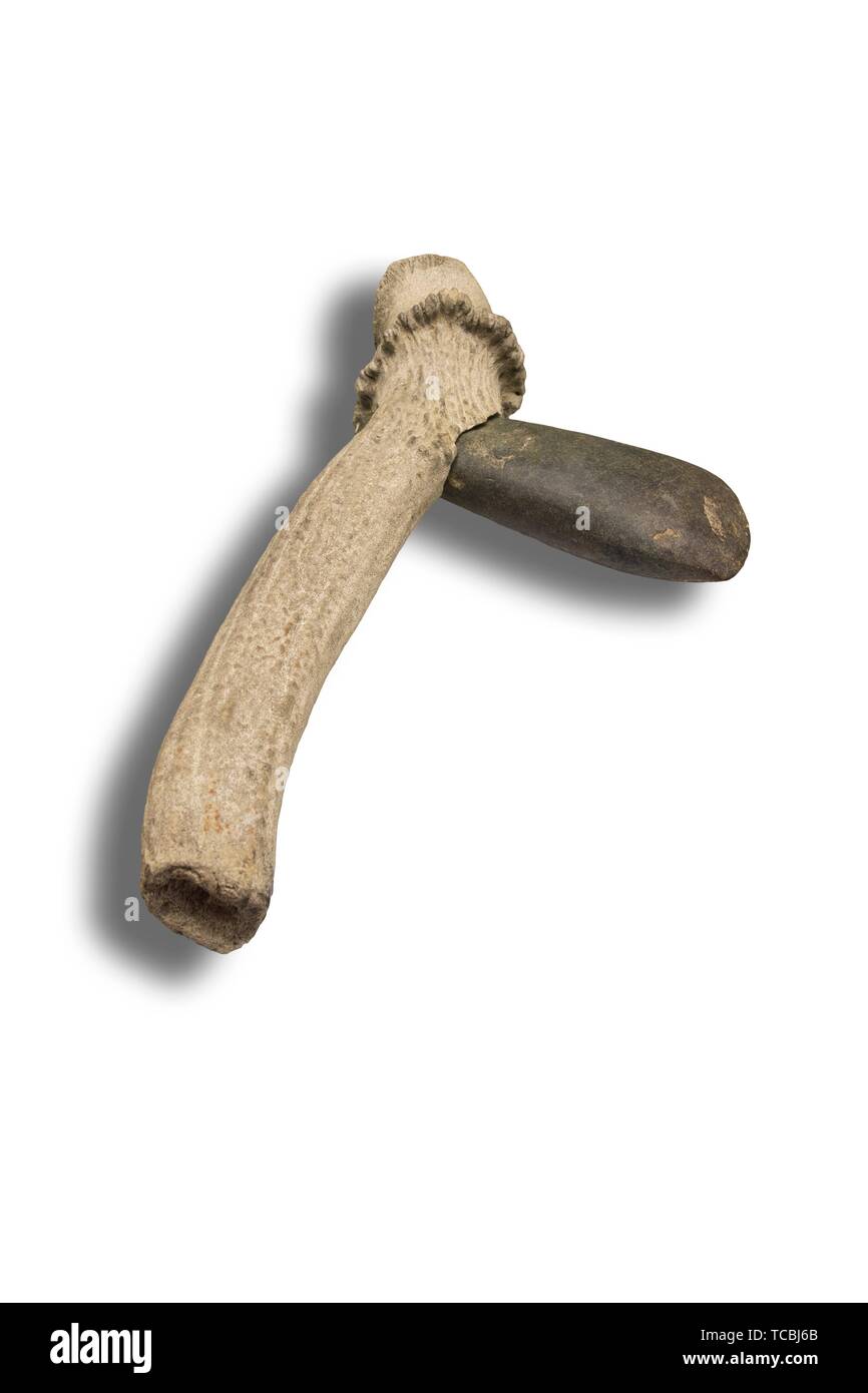 Lithic axe made with polished stone in deer antler handle. Replica. Isolated over white background. Stock Photo