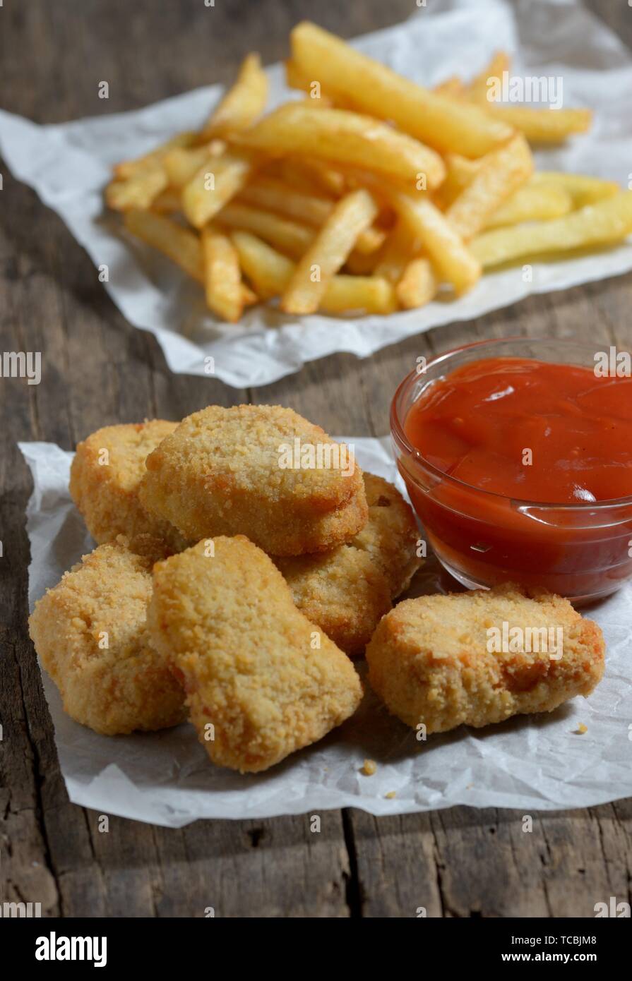 Chicken nuggets with ketchup and french fries Stock Photo Alamy