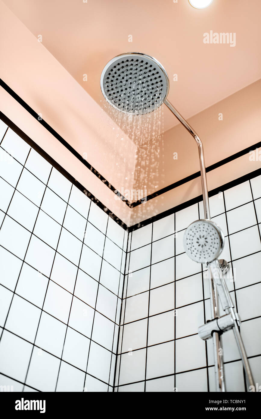 Shower with falling drops of water in the bathroom Stock Photo - Alamy