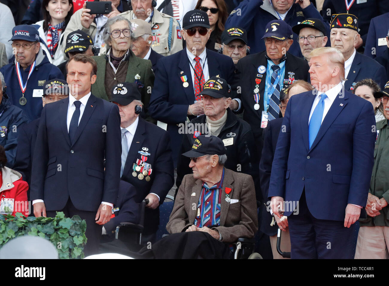 Normandy, France. 6th June, 2019. President Emmanuel Macron (L) and U.S. President Donald Trump (R) attend a ceremony to mark the 75th anniversary of the D-Day landings at the Normandy American Cemetery and Memorial in Colleville-sur-Mer, Normandy, France, June 6, 2019. A commemoration was held on Thursday in Normandy, north France, to mark the 75th anniversary of the D-Day landings against Nazi forces in World War II. Credit: Mao When/Xinhua/Alamy Live News Stock Photo