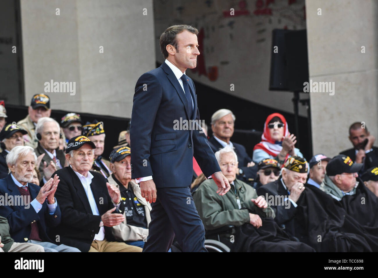 Colleville Sur Mer, France. 06th June, 2019. French President Emmanuel Macron walks to the stage to address a commemoration ceremony marking the 75th D-Day Anniversary at the Normandy American Cemetery and Memorial June 6, 2019 in Colleville-sur-Mer, France. Thousands have converged on Normandy to commemorate the 75th anniversary of Operation Overlord, the WWII Allied invasion commonly known as D-Day. Credit: Planetpix/Alamy Live News Stock Photo