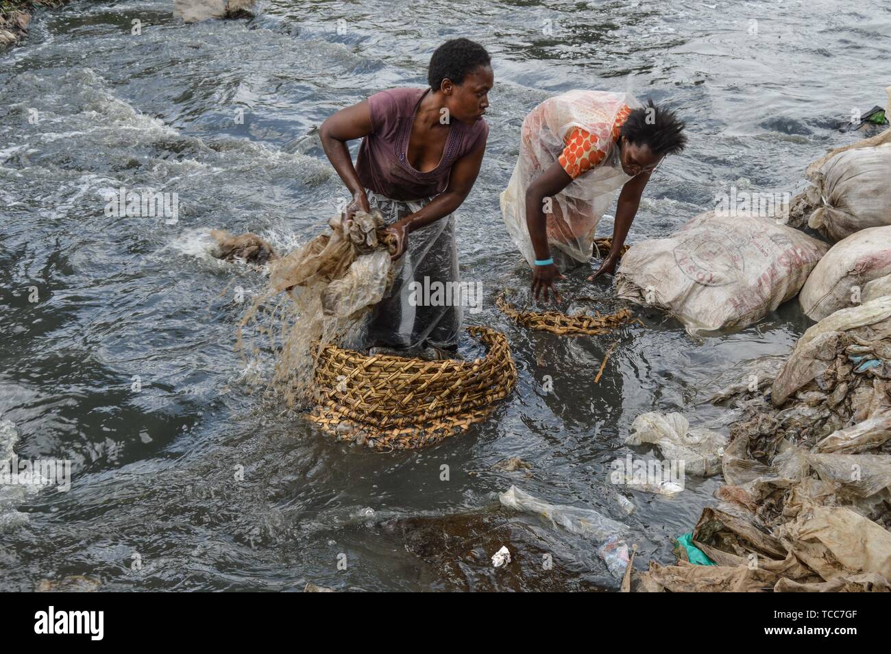Nairobi, Kenya. 13th Sep, 2018. Women seen washing sheets of plastic in