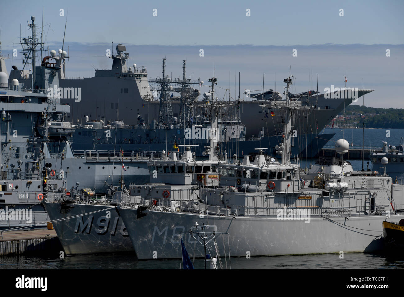 Kiel, Germany. 07th June, 2019. Naval vessels (in the background the Spanish aircraft carrier "Juan Carlos I.") lie in the naval port for the start of the manoeuvre Baltic Operations (BALTOPS). Warships from 18 nations take part in the manoeuvre on the Baltic Sea starting on 08.06.2019. Credit: Carsten Rehder/dpa/Alamy Live News Stock Photo