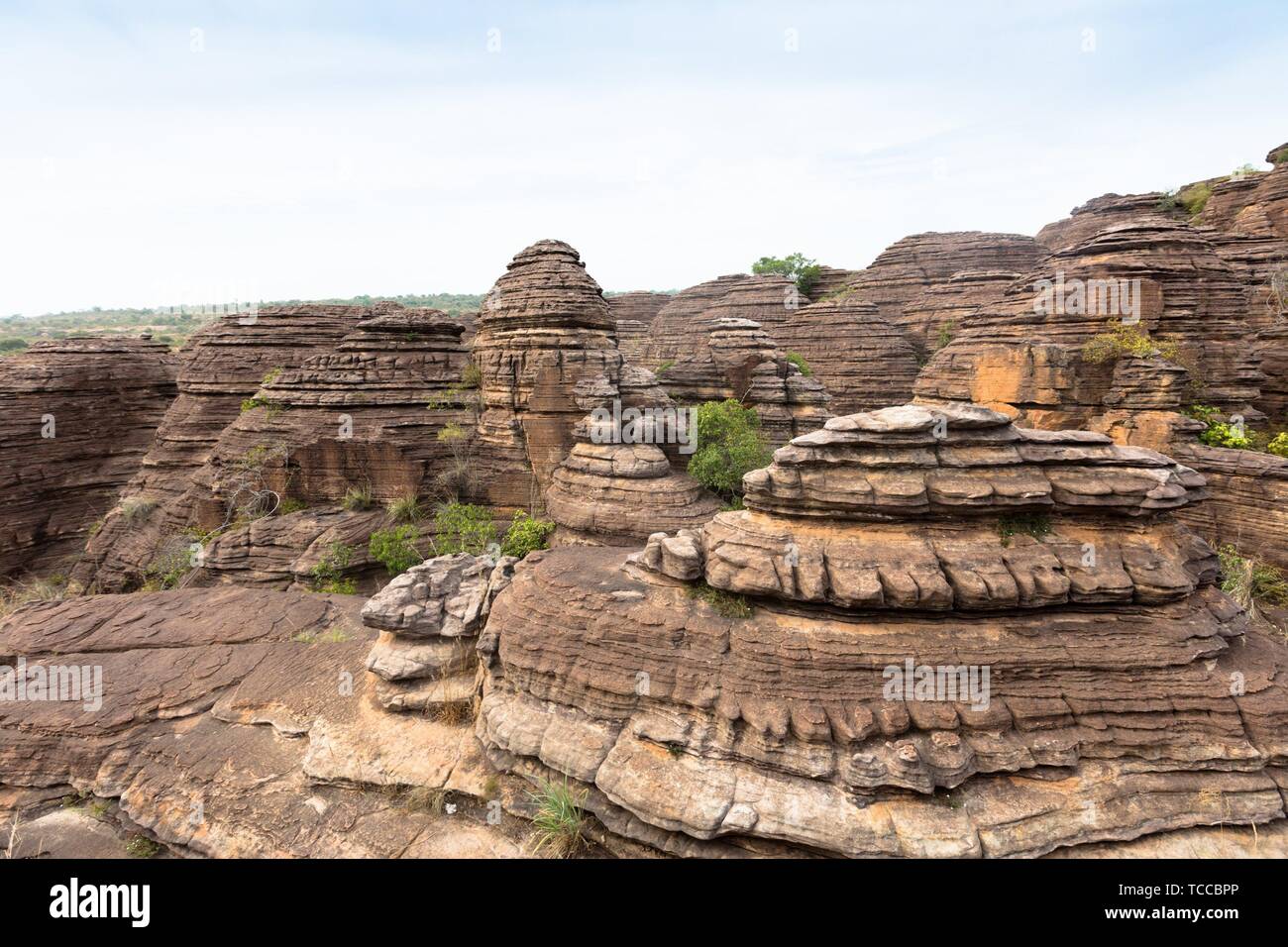 the Domes de Fabedougou are natural phenomenon of rock sculpted by vwind and erosion in Burkina faso look like a stack of pancakes. Stock Photo