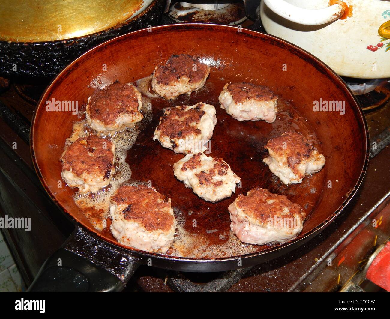 Cooking roast veal and pork cutlets Stock Photo Alamy