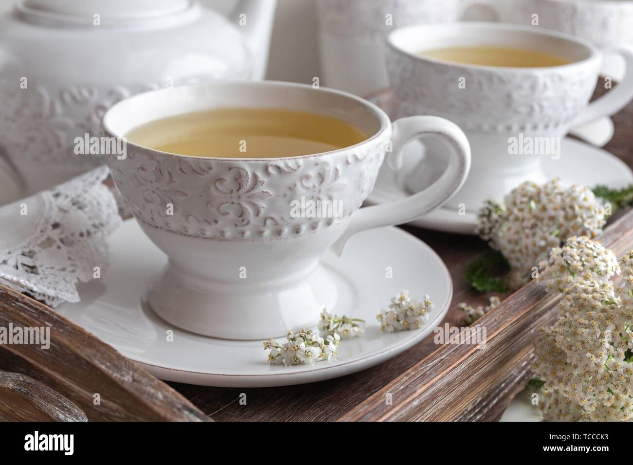 Yarrow tea in white vintage cups with fresh twigs Stock Photo Alamy