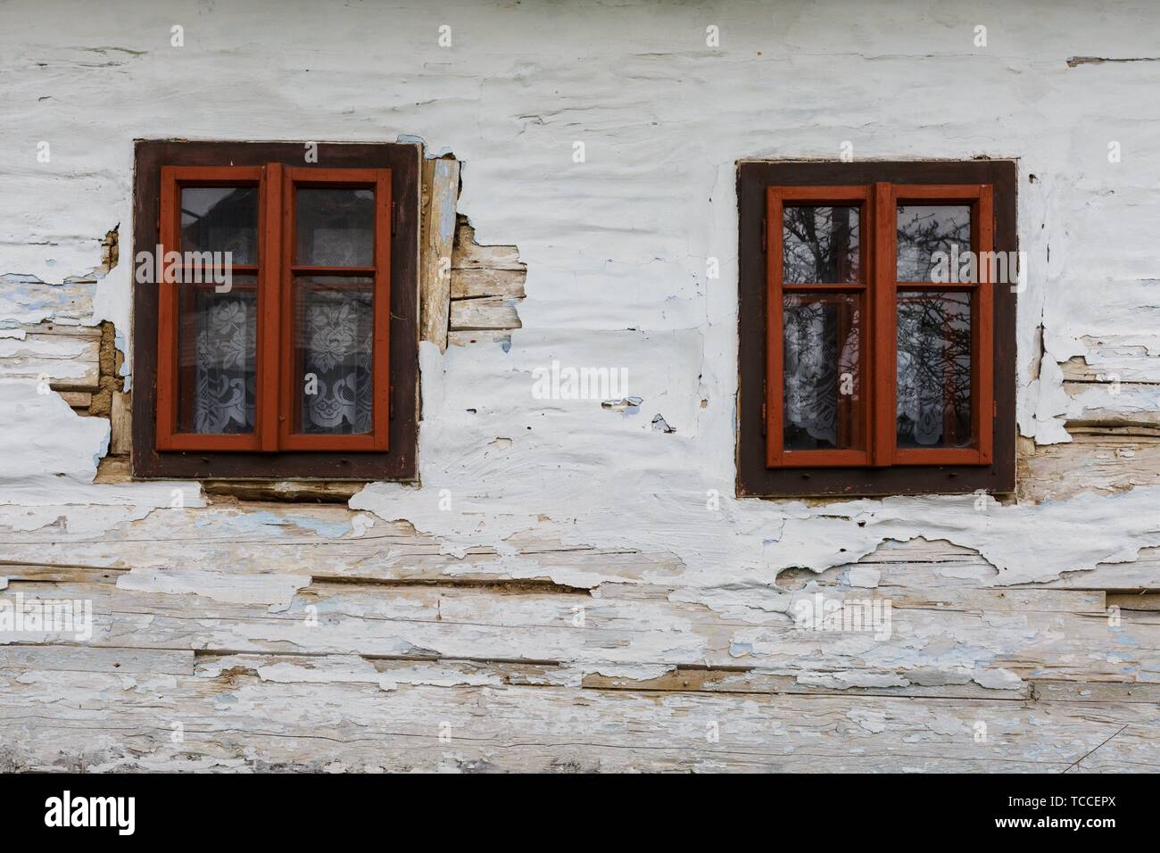 Windows of a traditional log cabin in Zilina region, Slovakia. Stock Photo