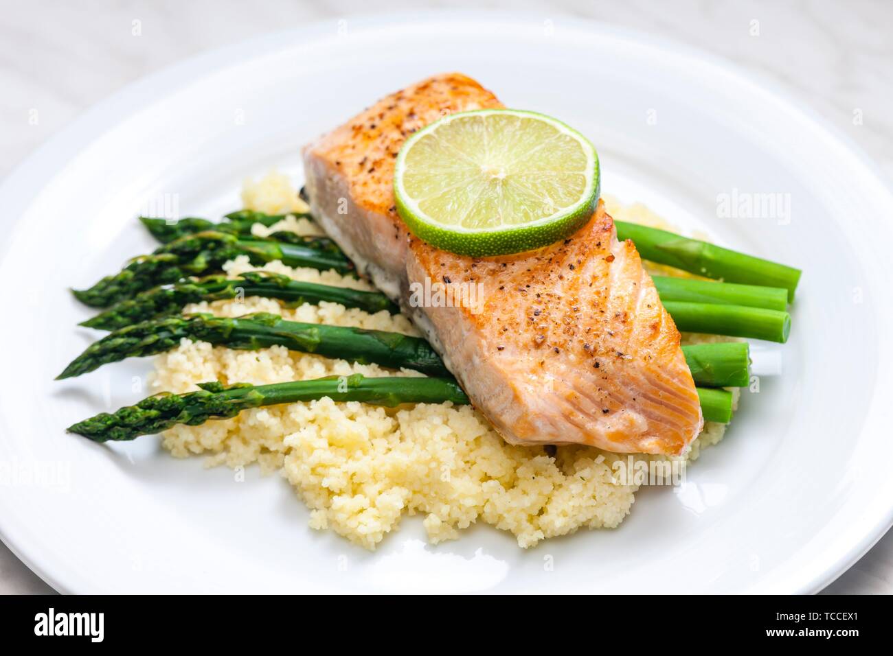 salmon with asparagus and couscous Stock Photo Alamy