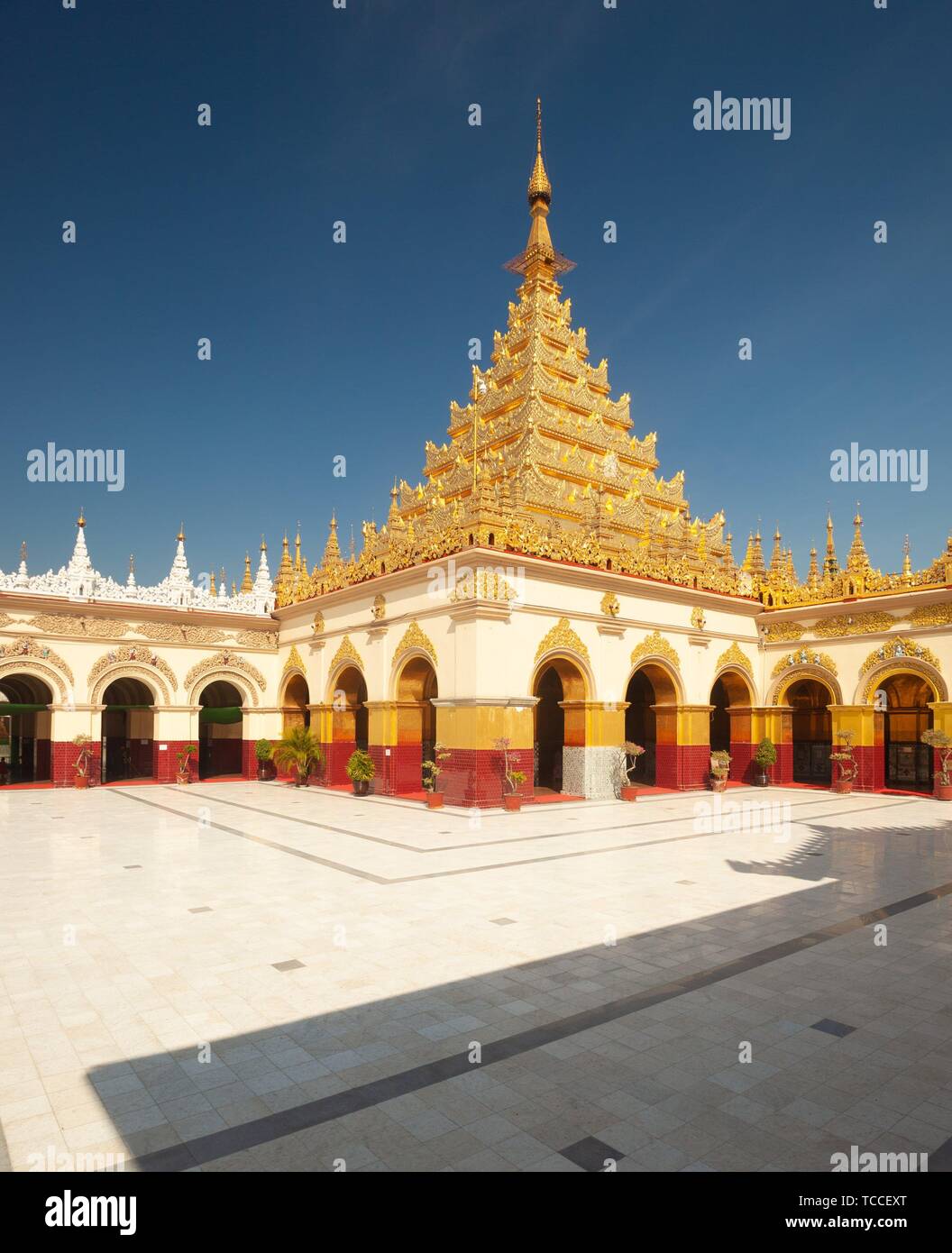 The golden pagoda and courtyard at Mahamuni Paya temple, Mandalay, Myanmar. Stock Photo
