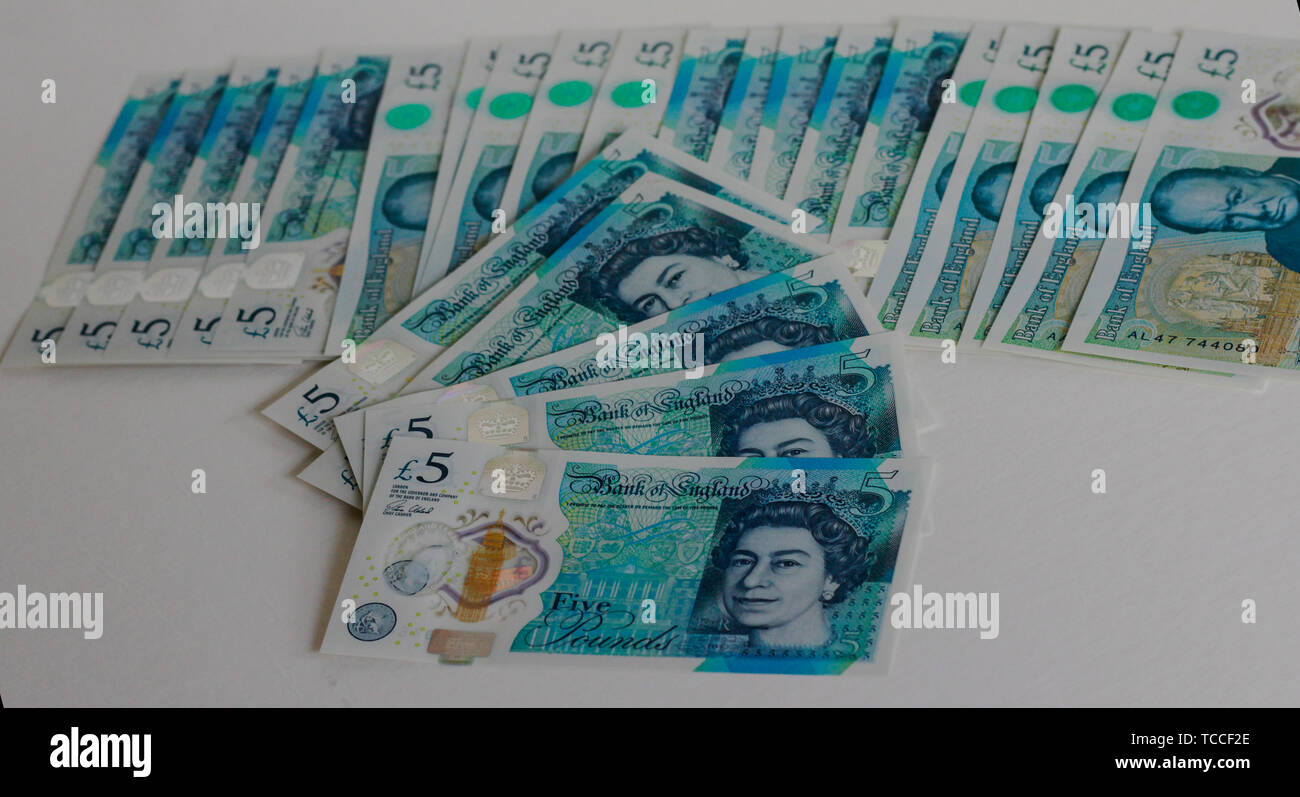 Five pound banknotes on a white background, Bank of Scotland £5 note, a fiver, banknote of the pound sterling, May 2019, UK. Stock Photo