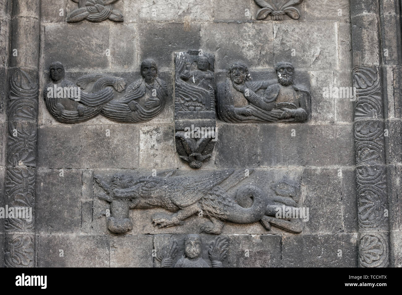 Detail of richly decorated with ornamental and figural sculptures Scotish portal (Schottenportal) of Scots Monastery church (Schottenkirche), the form Stock Photo