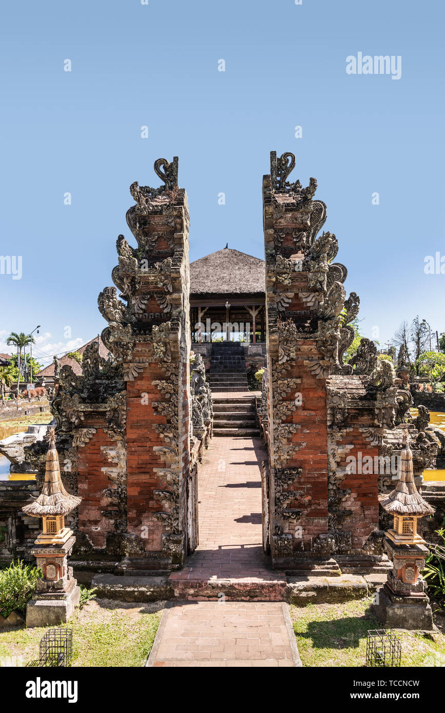Klungkung, Bali, Indonesia - February 26, 2019: Closeup of Split Gate entrance with Floating Pavilion behind at Royal Palace of Klungkung Kingdom unde Stock Photo