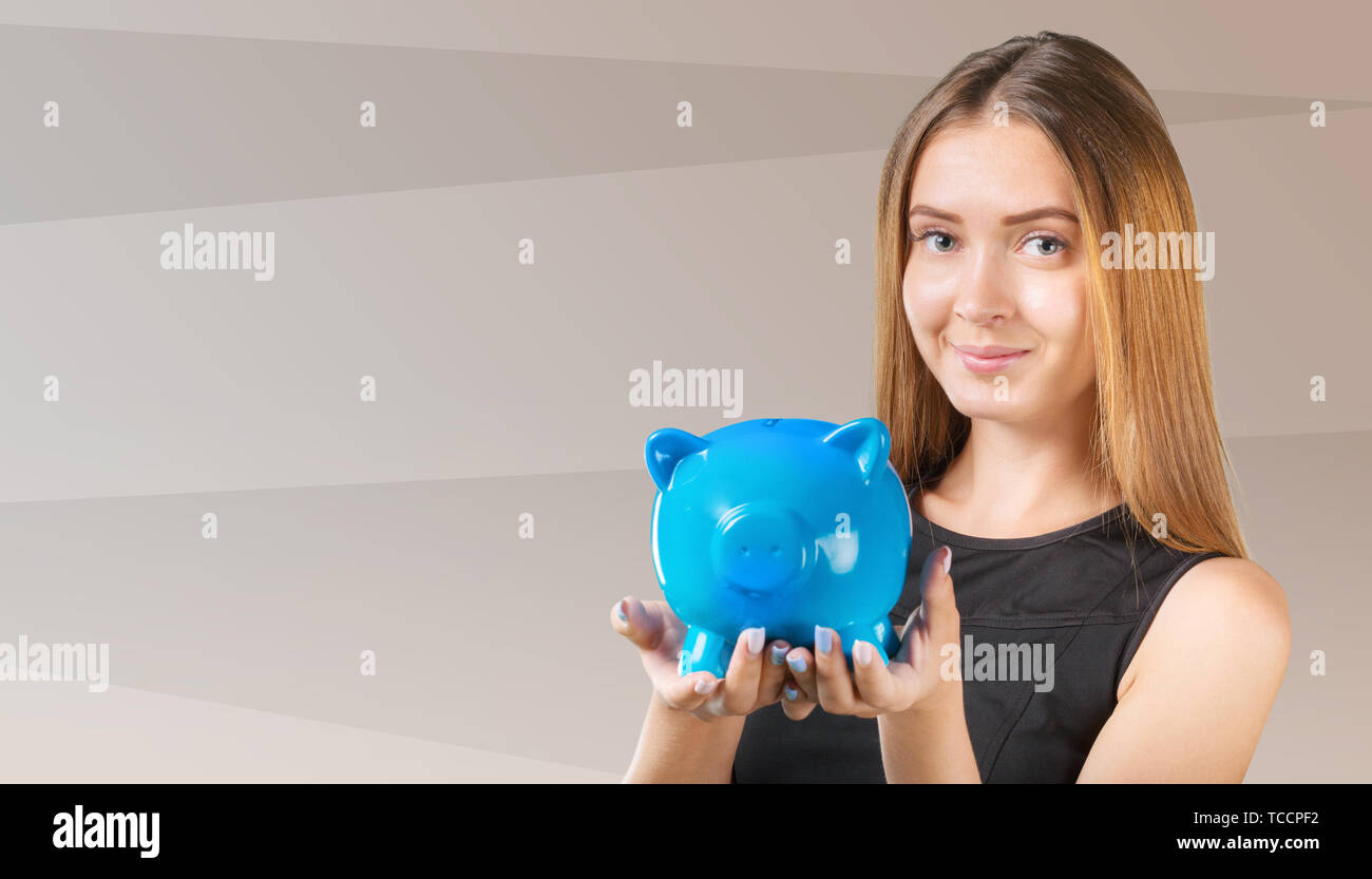 woman with a piggy bank Stock Photo - Alamy