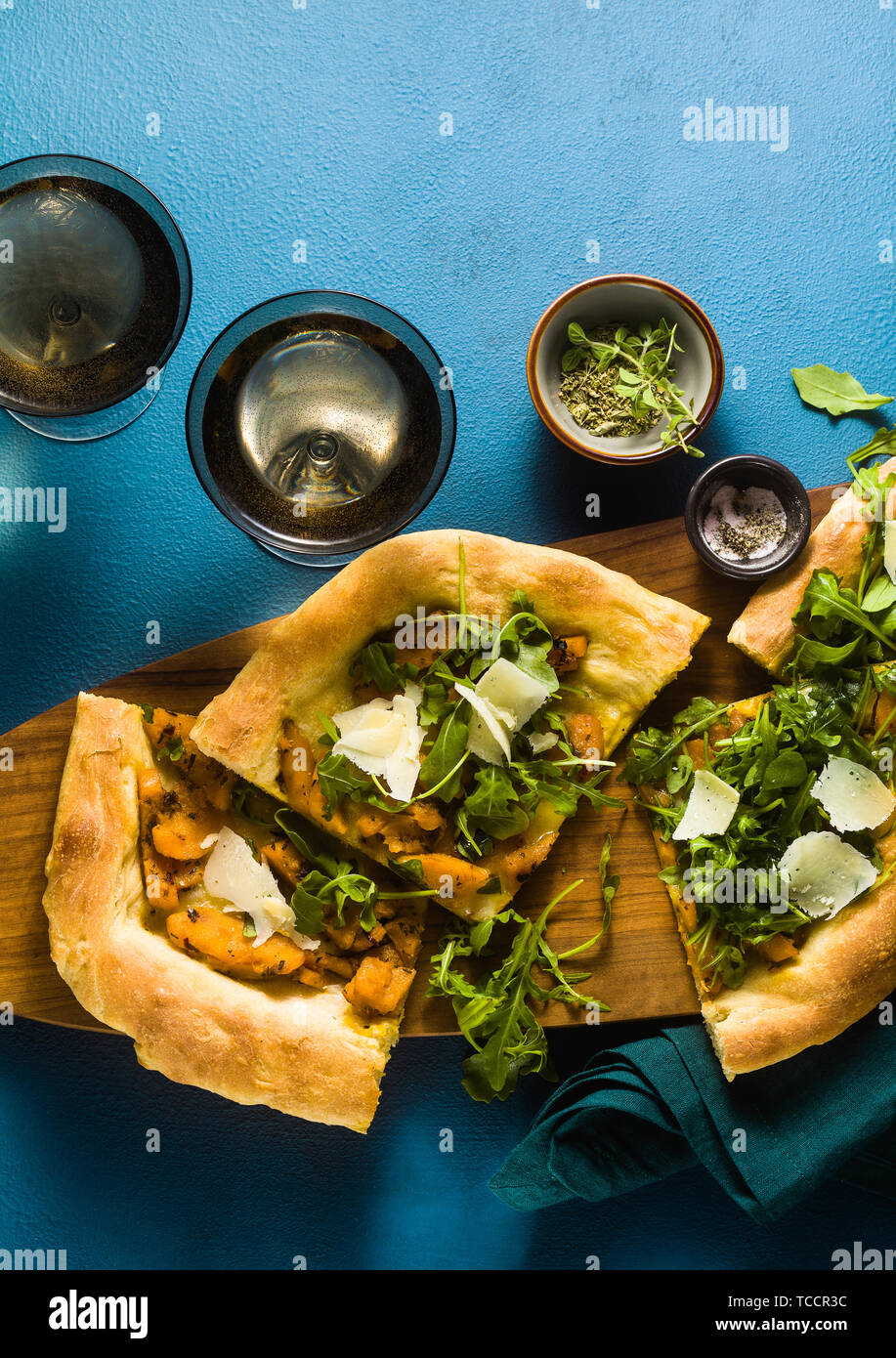 traditional Italian white pizza with taleggio and pecorino cheese, caramelized pumpkin and