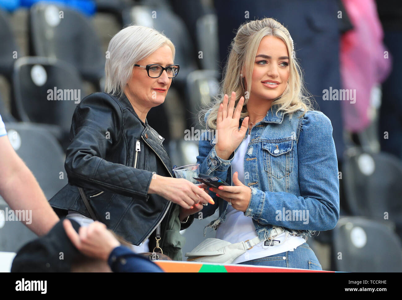 Megan Davison (right) fiancee of England goalkeeper Jordan Pickford in the stands during the Nations League Semi Final at Estadio D. Alfonso Henriques, Guimaraes. Stock Photo