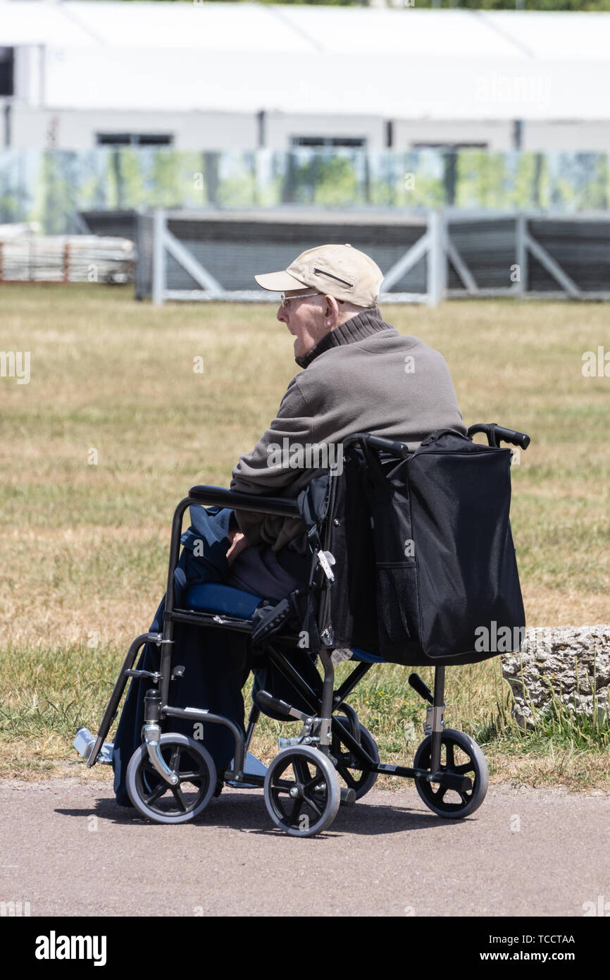 An elderly man alone in a wheelchair Stock Photo