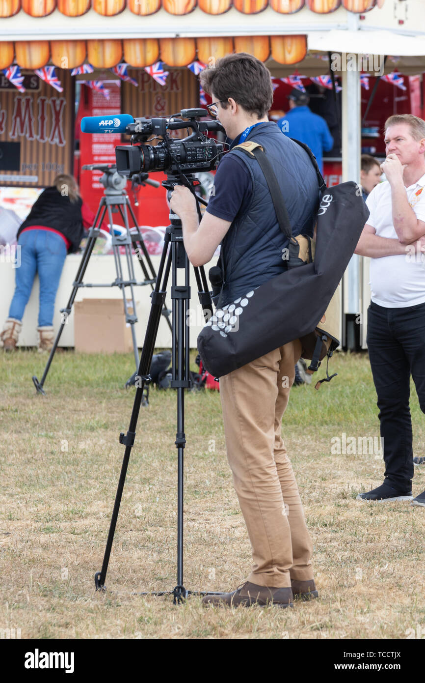 A camera crew setting up for a live broadcast Stock Photo