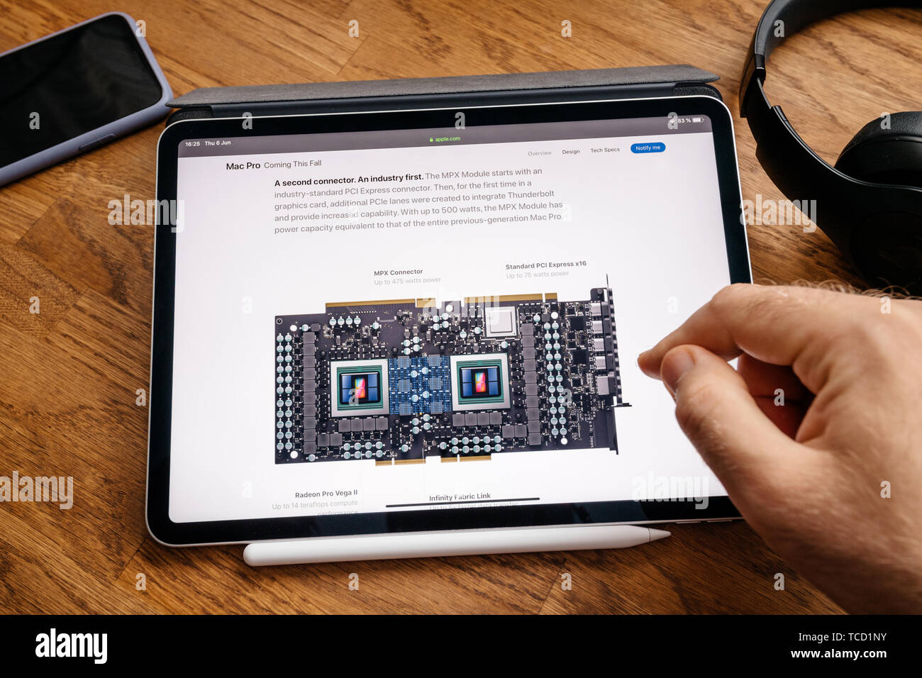 Paris, France - Jun 6, 2019: Man reading on Apple iPad Pro tablet about  latest announcement of at Developers Conference WWDC - showing the Mac Pro  workstation with MPX module example Stock Photo - Alamy