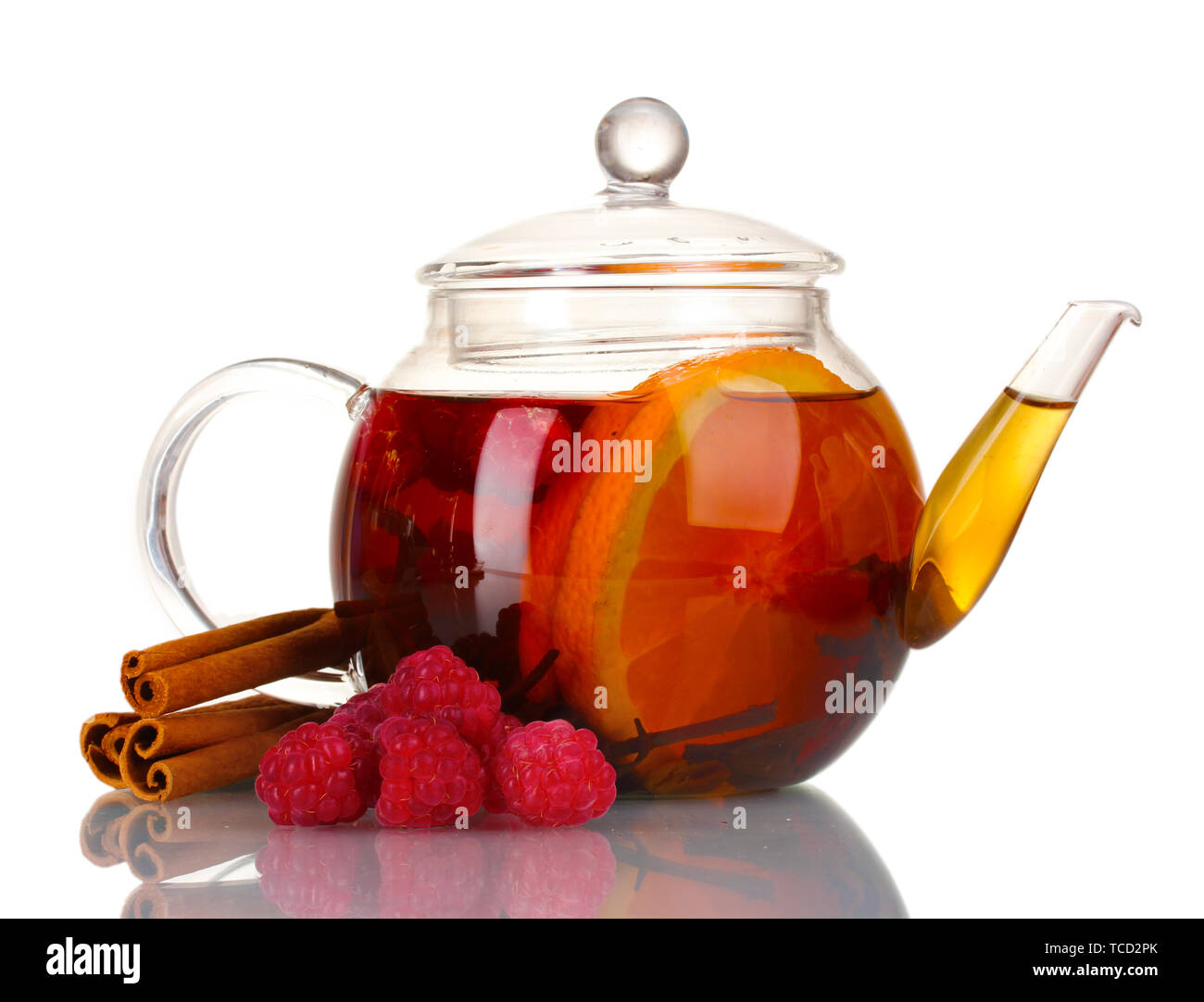 Glass teapot with black tea of raspberries,orange, cinnamon isolated on ...