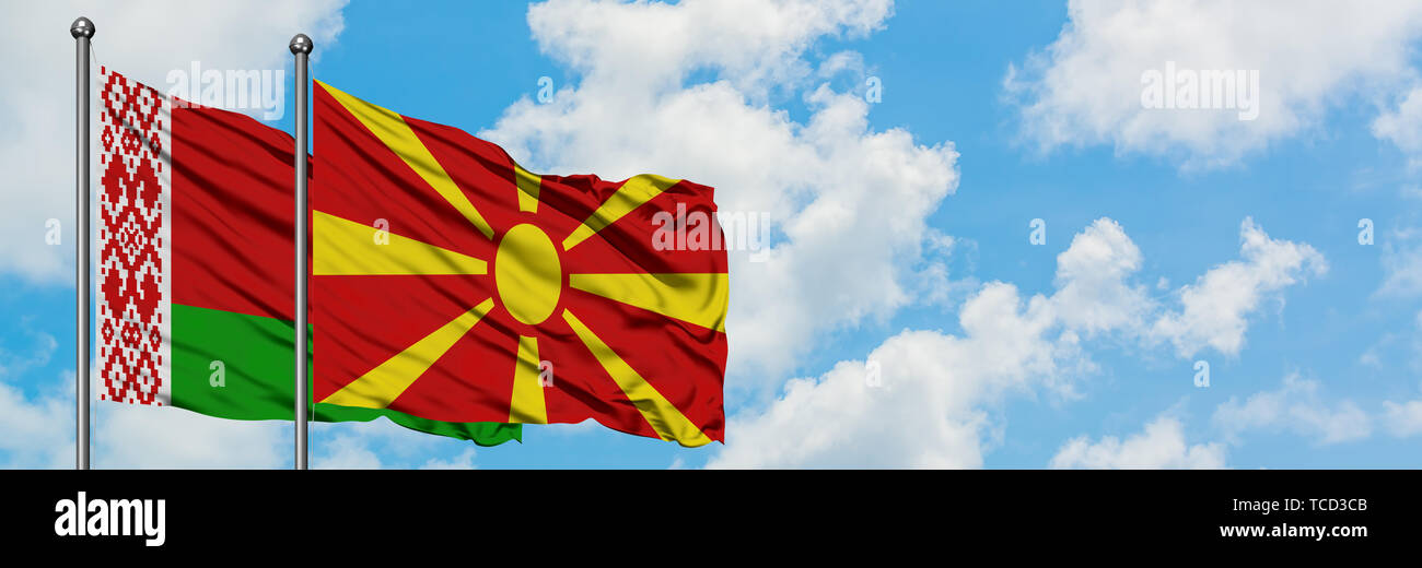 Belarus and Macedonia flag waving in the wind against white cloudy blue ...