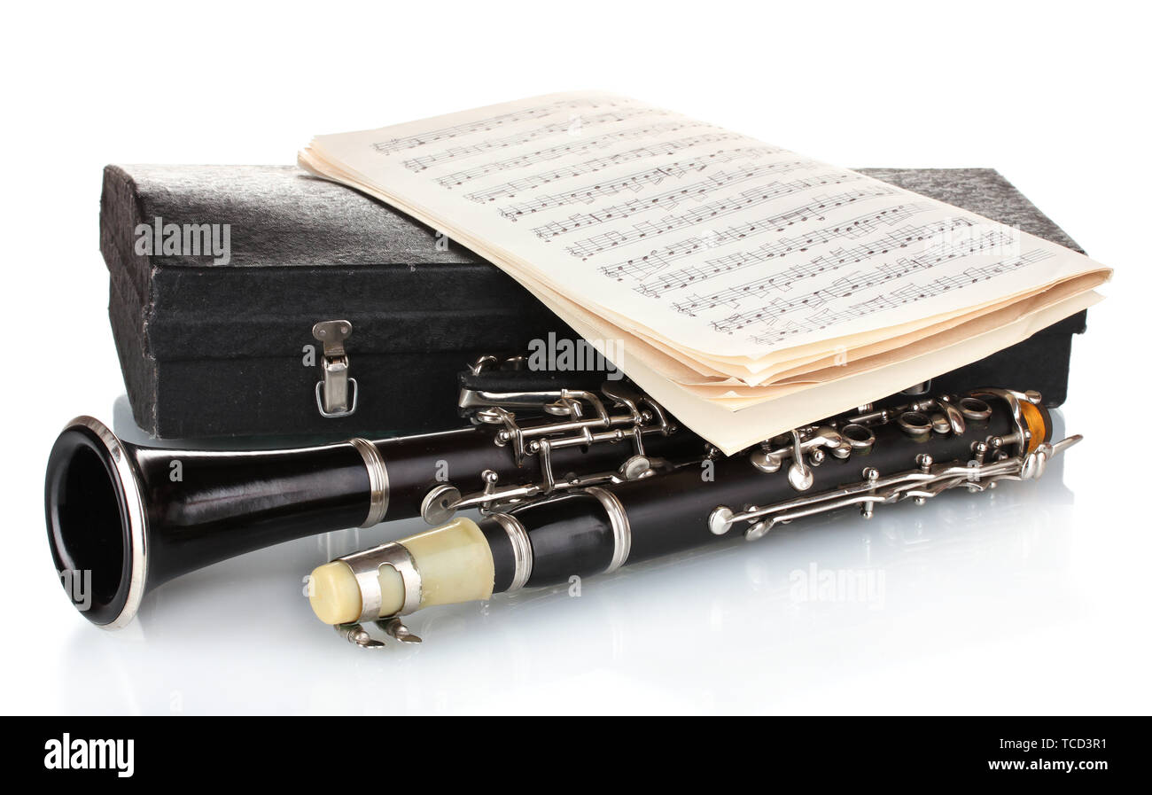 Antique clarinet, case and notebook with notes isolated on white Stock Photo