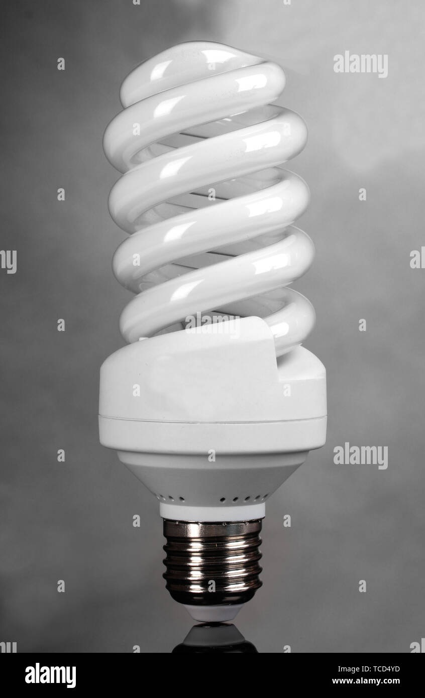 energy saving light bulb on gray background Stock Photo - Alamy