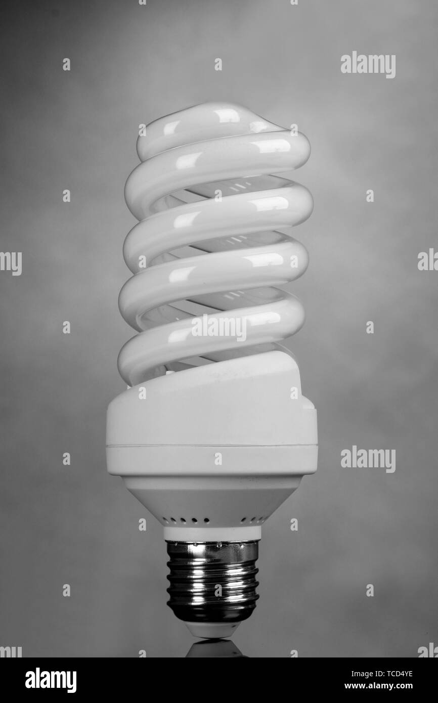 energy saving light bulb on gray background Stock Photo - Alamy
