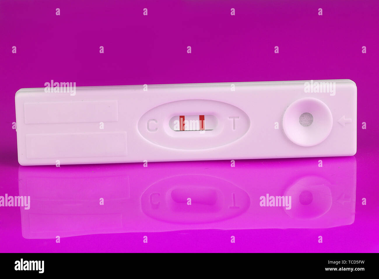 positive pregnancy test on purple background Stock Photo - Alamy