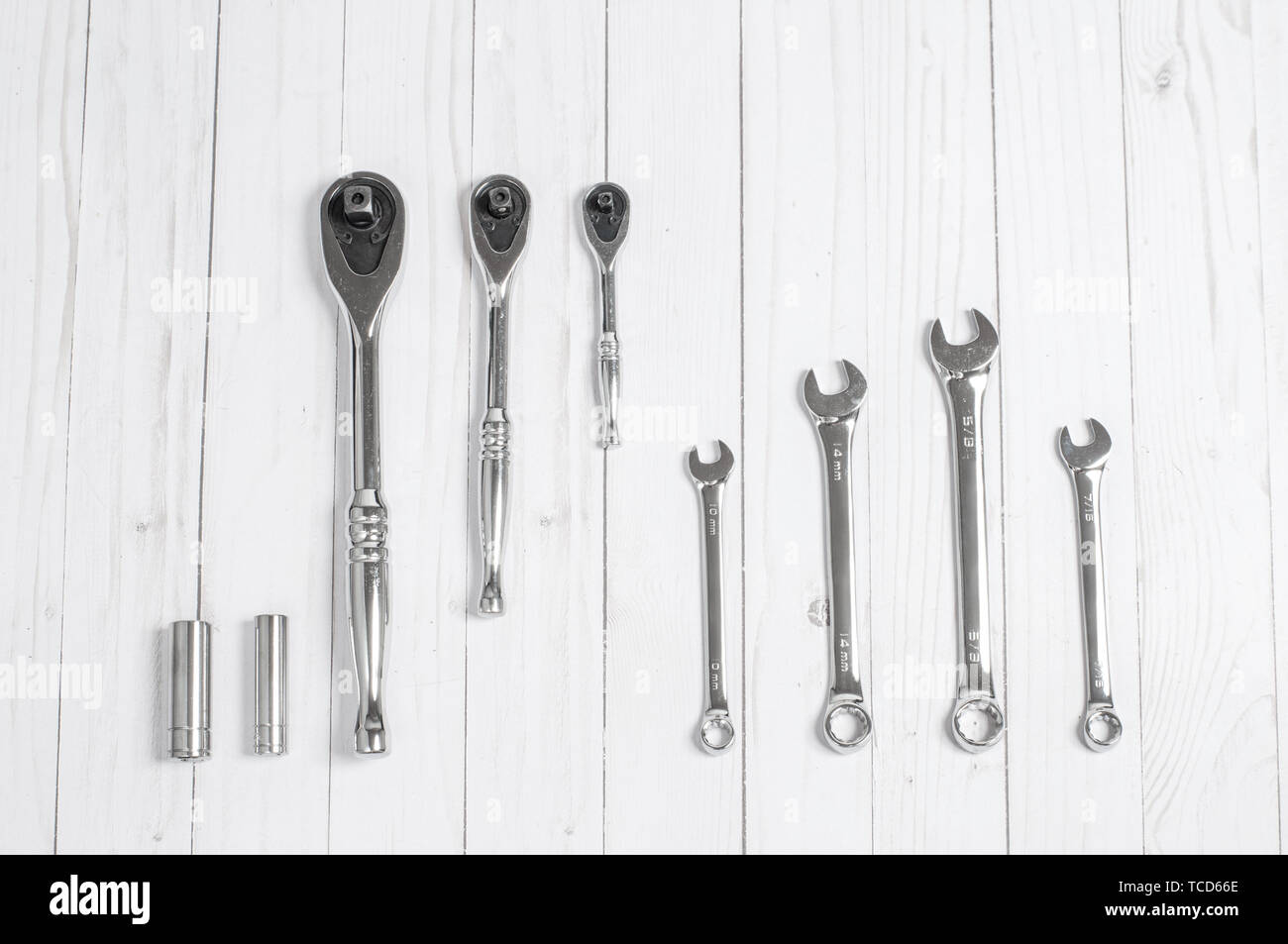 Tools, set wrenches on a white wooden background. Top view Stock Photo