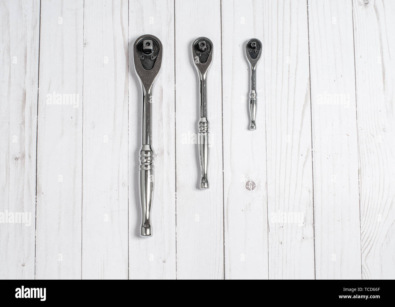 Tools, socket wrenches on a white wooden background. Top view Stock Photo