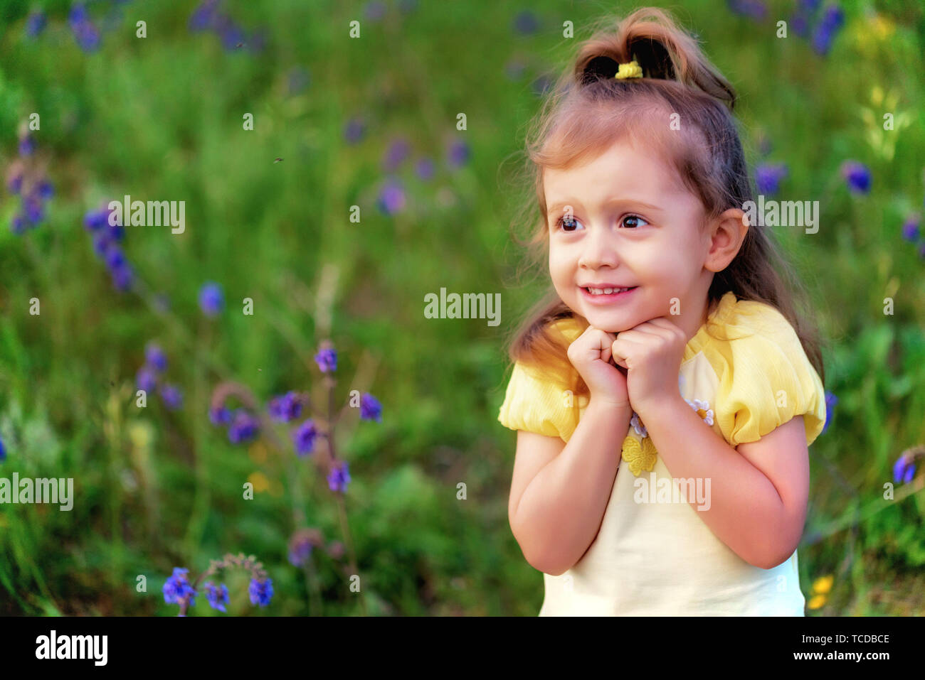 Cute funny baby girl scared of insect outdoors in green field. Child portrait Stock Photo - Alamy Cute funny baby girl scared of insect outdoors in green field. Child portrait Stock Photo - Alamy