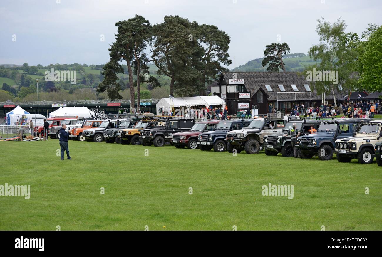 A display of Land Rovers old and new, including Series One, Defender and Discovery models  at the Royal Welsh Spring Festival Stock Photo