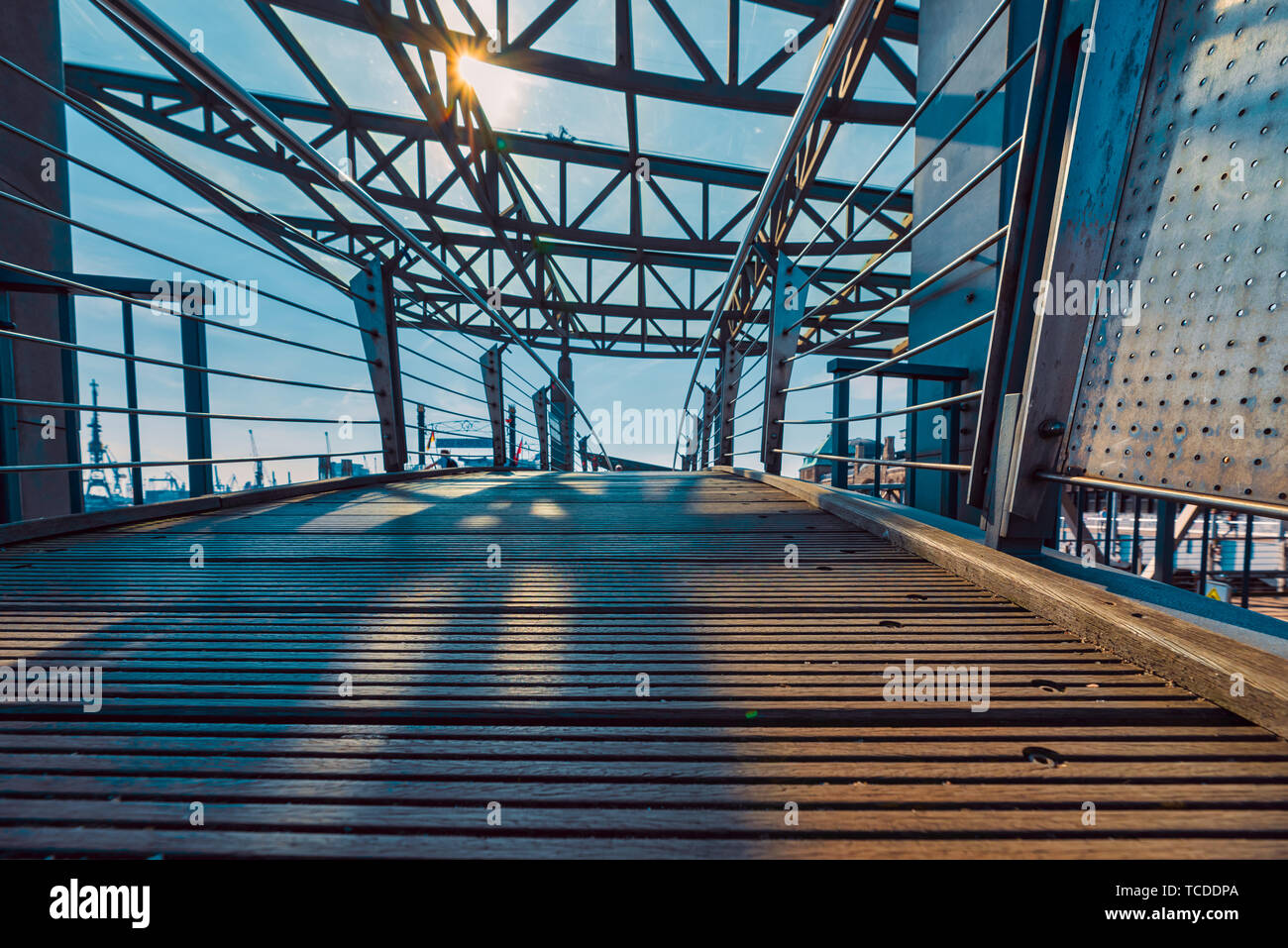 HAMBURG, GERMANY - June 01, 2019: The Landungsbrücken are connected with the main land with little bridges that are made of woods and steel Stock Photo