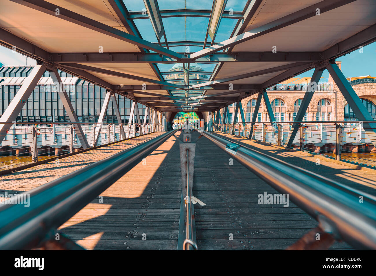 HAMBURG, GERMANY - June 01, 2019: The Landungsbrücken are connected with the main land with little bridges that are made of woods and steel Stock Photo