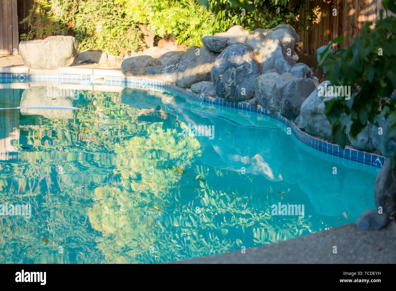 Rock Landscape Waterfall On Swimming Pool Edge Stock Photo Alamy
