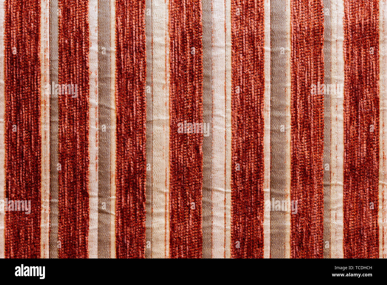 red striped synthetic woven upholstery fabric closeup texture Stock