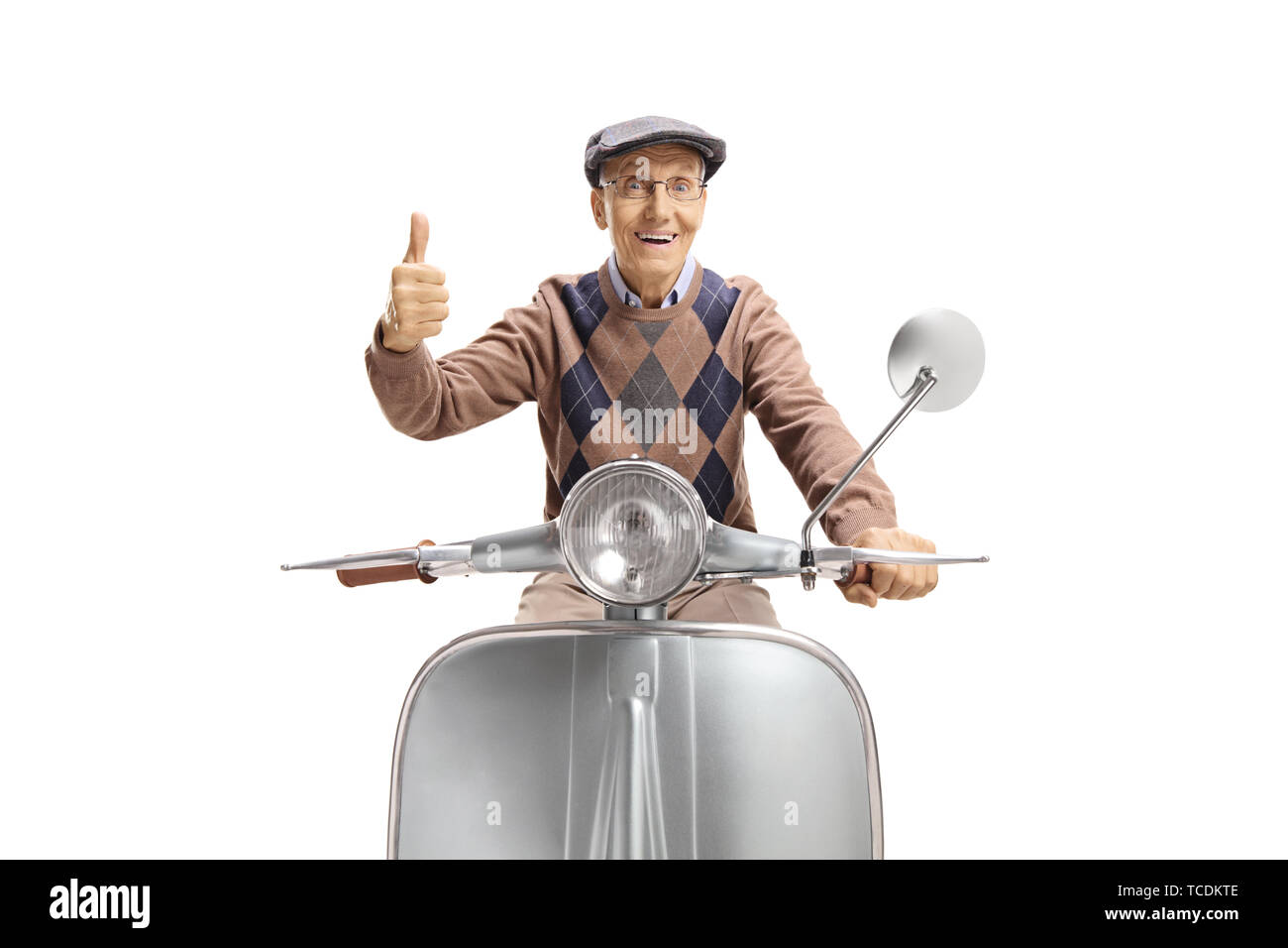Happy senior man riding a vintage scooter and giving thumbs up isolated on white background Stock Photo
