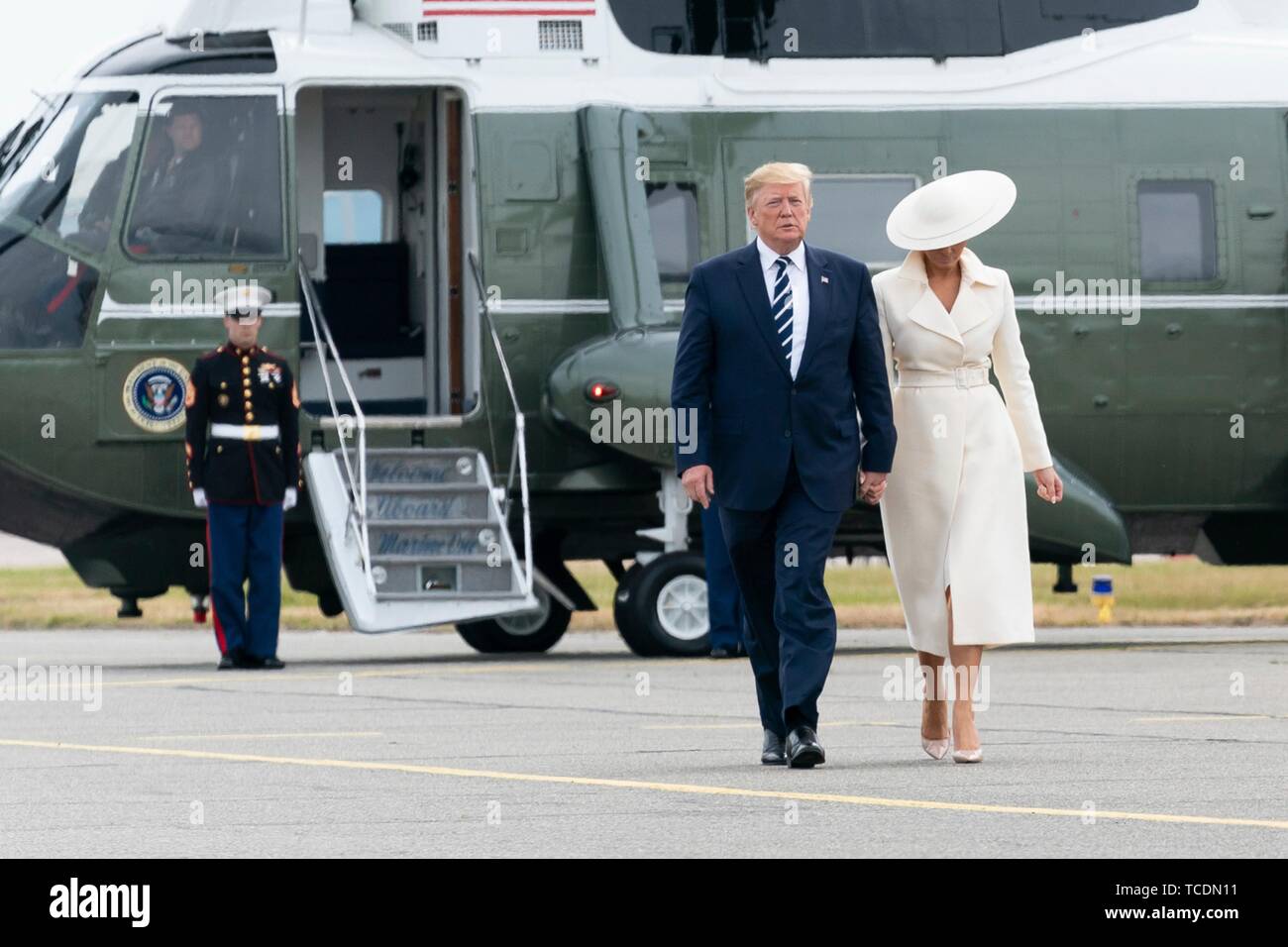 U.S President Donald Trump and First Lady Melania Trump walk to Air Force One after landing aboard Marine One at Southampton Airport June 5, 2019 in Southhampton, England. The first couple are departing to spend the night at the presidents golf resort in Doonbeg, Ireland. Stock Photo
