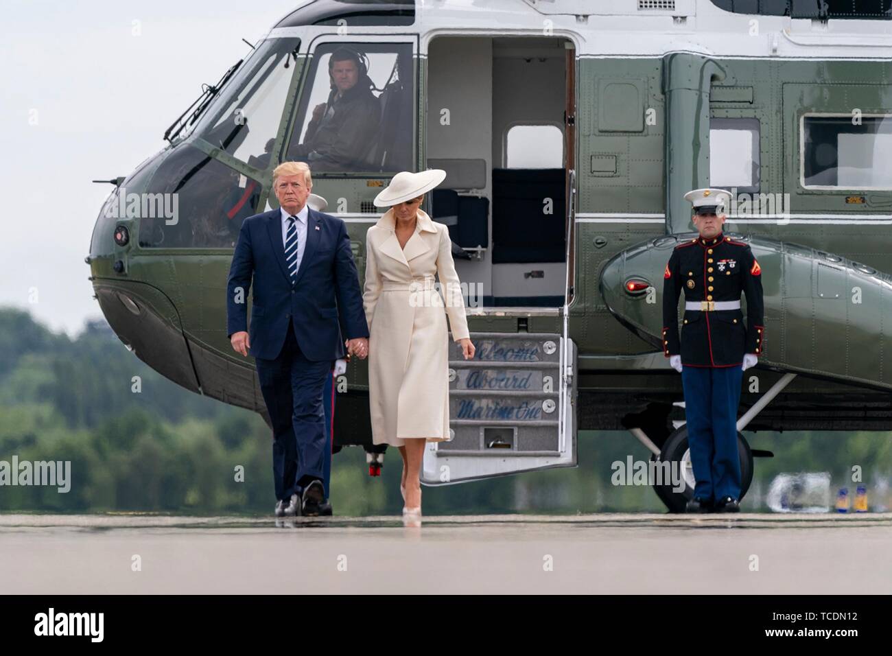U.S President Donald Trump and First Lady Melania Trump walk to Air Force One after landing aboard Marine One at Southampton Airport June 5, 2019 in Southhampton, England. The first couple are departing to spend the night at the presidents golf resort in Doonbeg, Ireland. Stock Photo