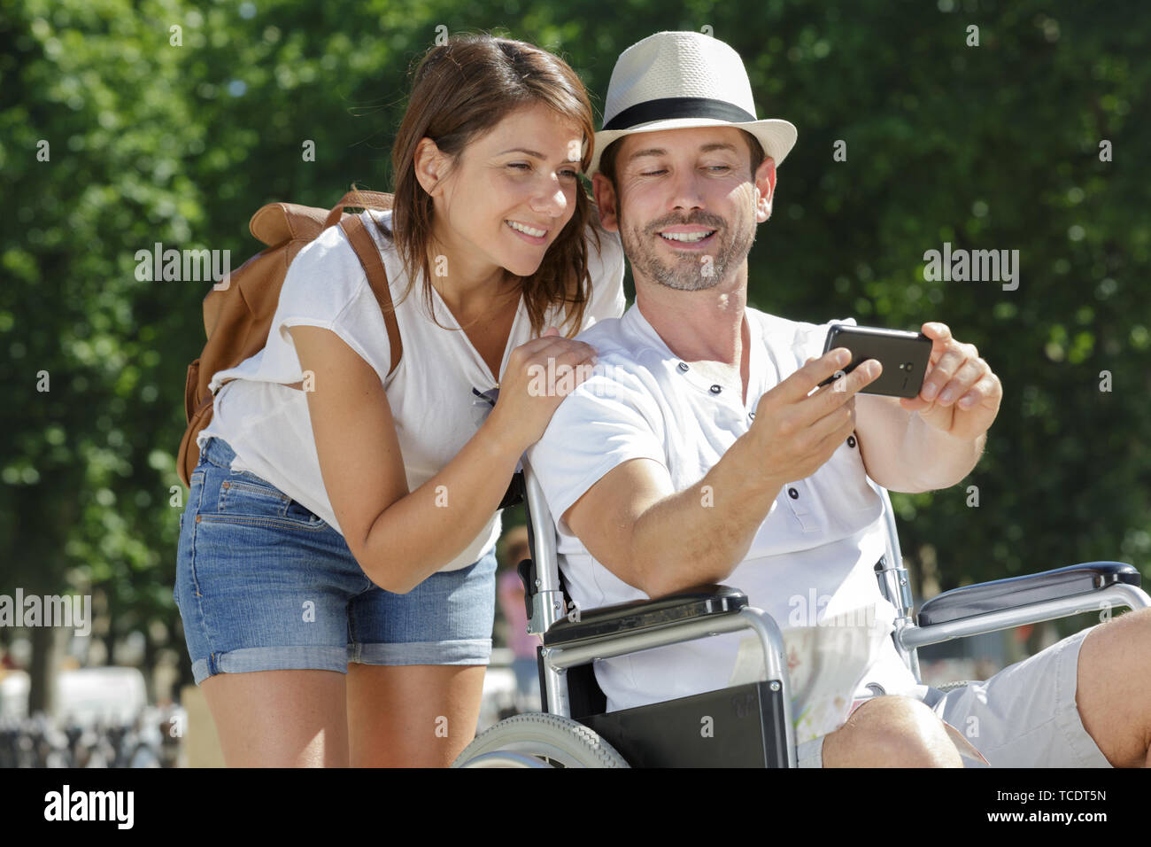 handicapped boyfriend taking selfie with girlfriend Stock Photo - Alamy