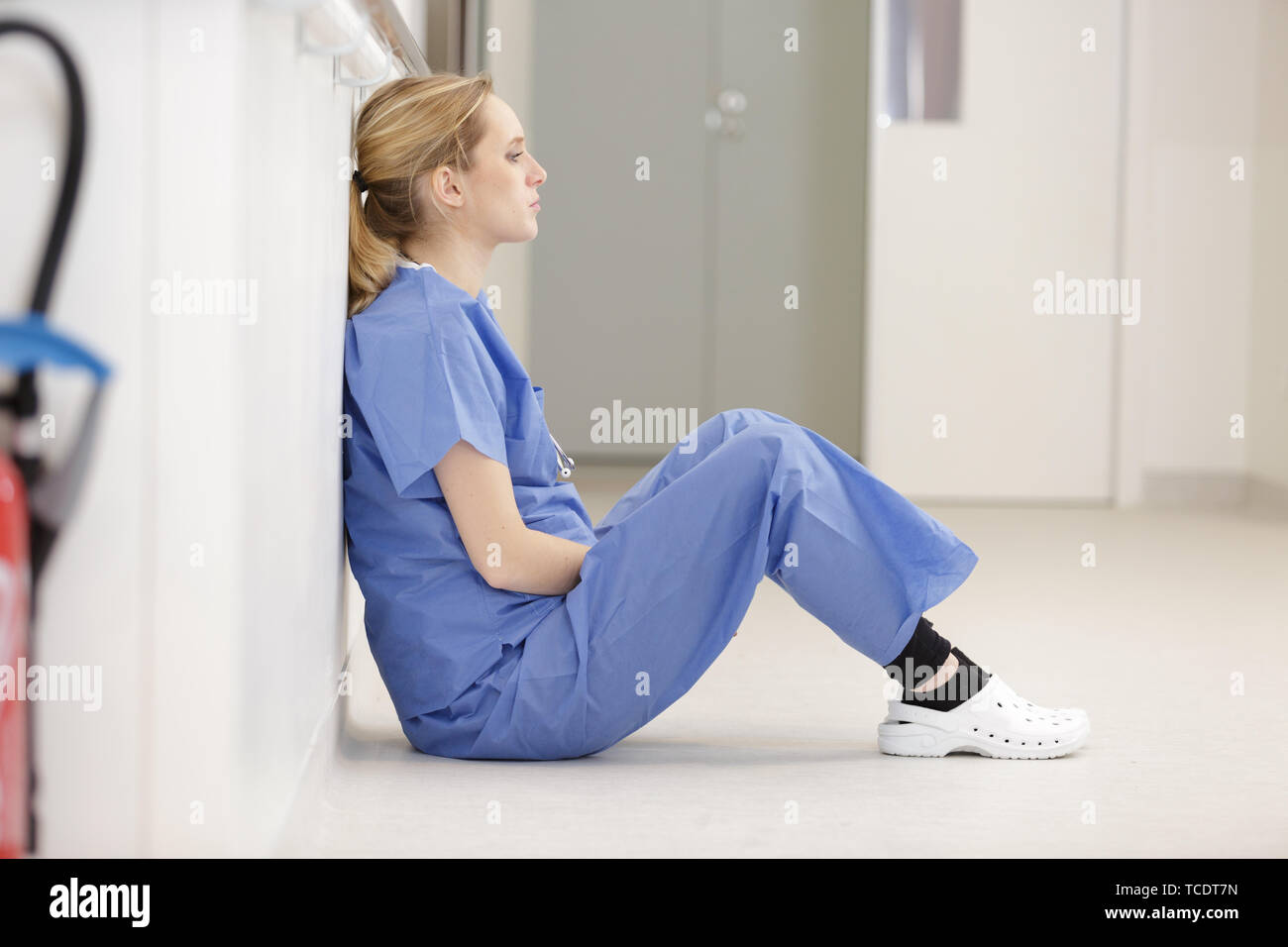 Upset Nurse Sitting On Floor Stock Photo 248625433 Alamy