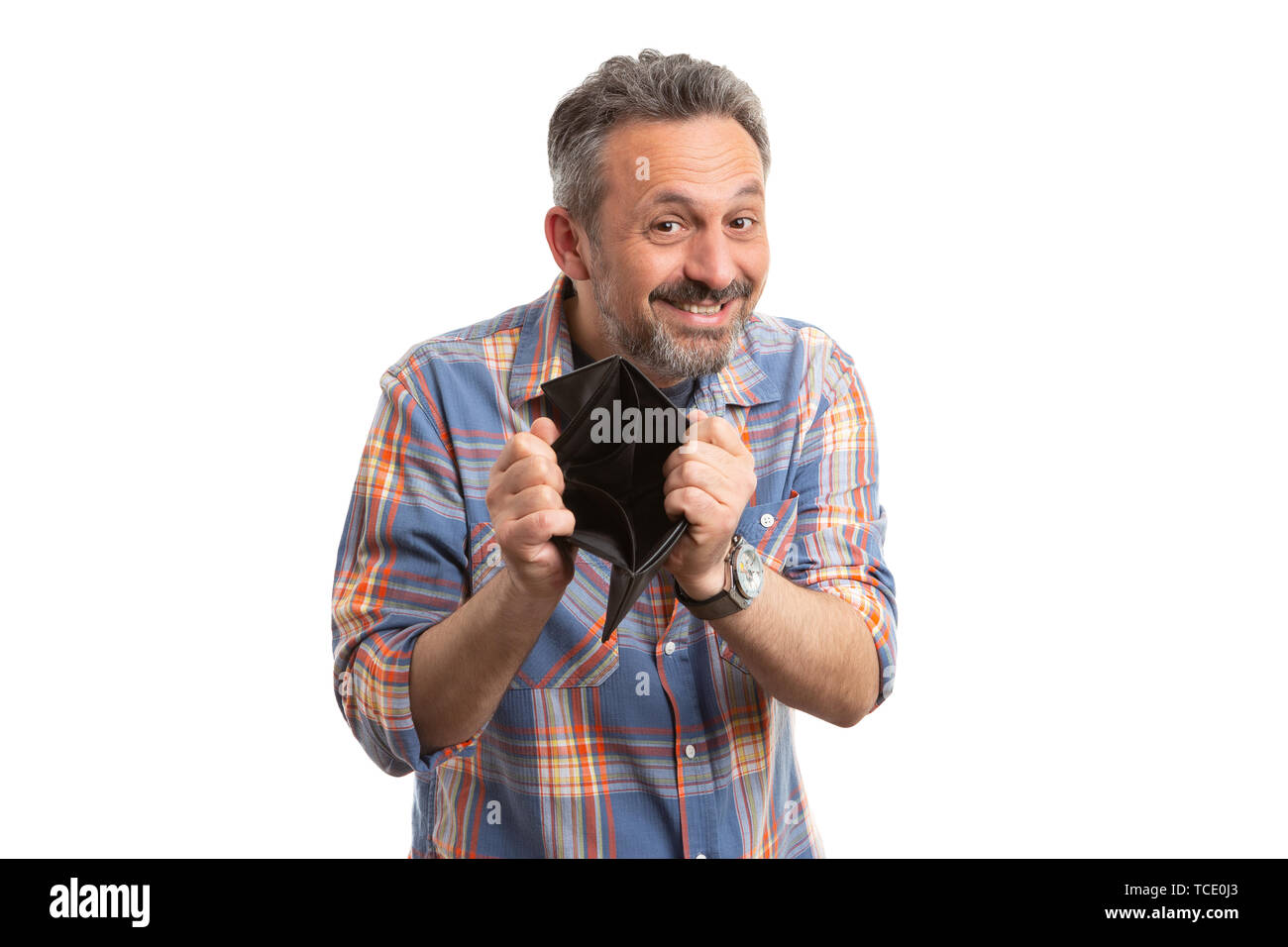 Man smiling as showing empty brown leather wallet as moneyless concept ...