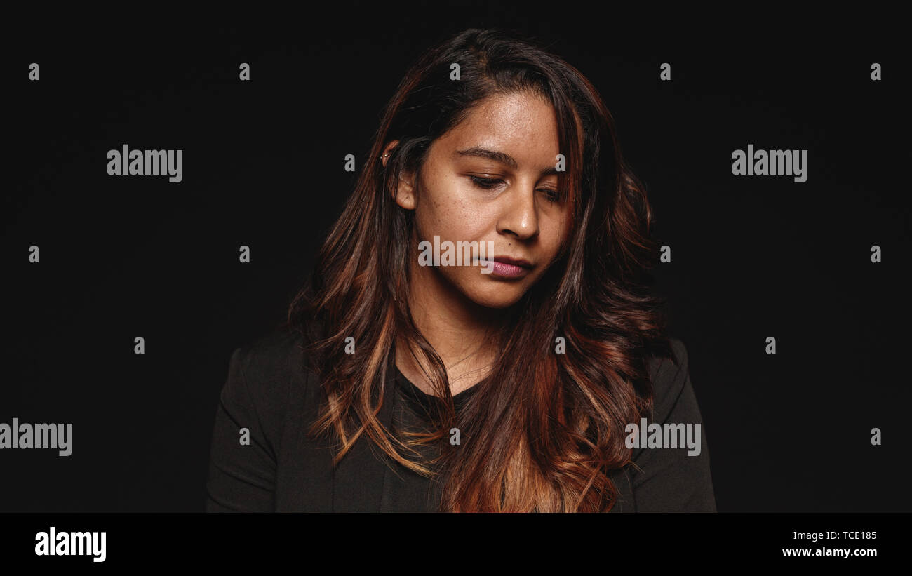 Close up woman face looking down hi-res stock photography and images ...