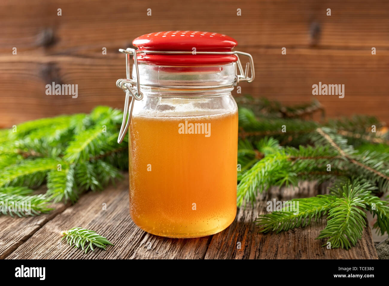 Homemade herbal syrup against cough made from young spruce tips Stock Photo
