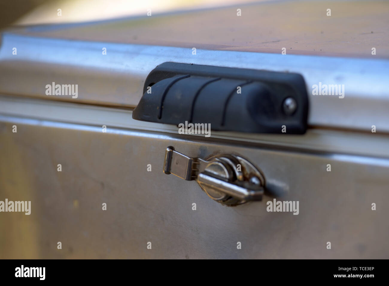 Closeup view of locking latch of steel ice chest Stock Photo