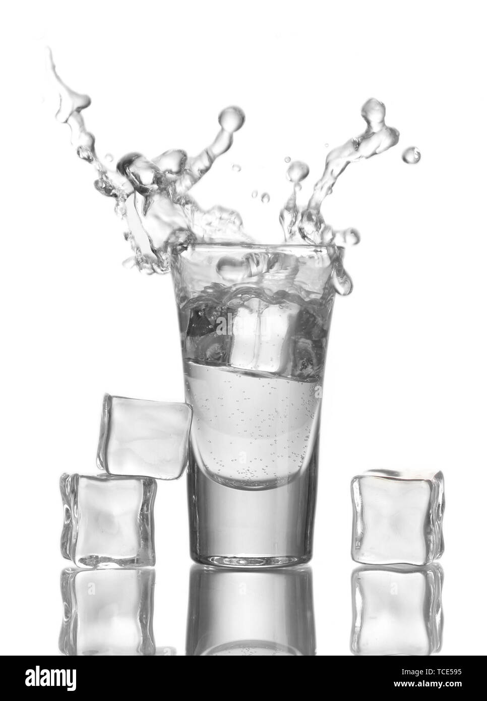 glass vodka and ice isolated on white Stock Photo Alamy
