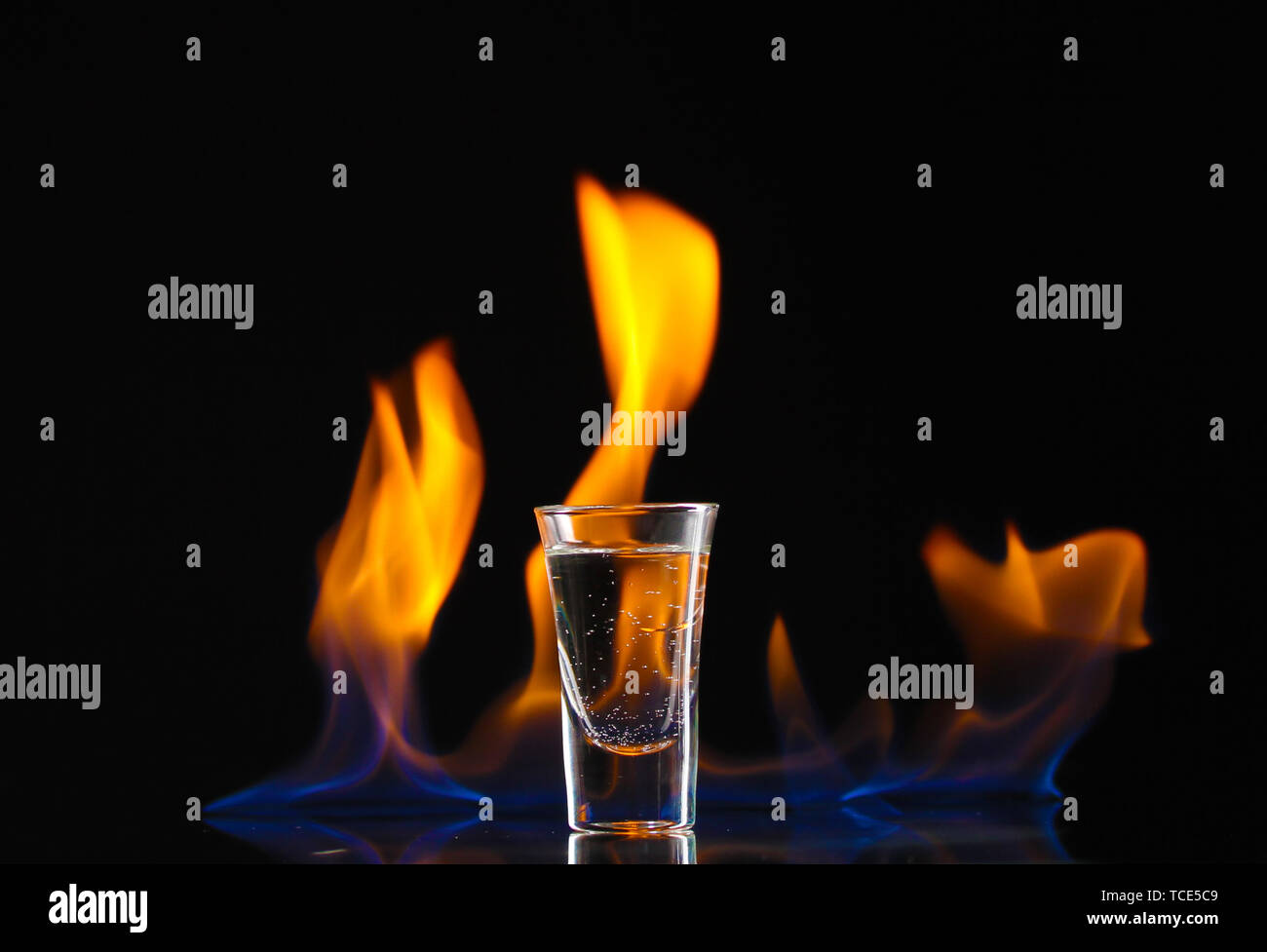 Flaming vodca on black background Stock Photo